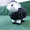 Mini lam met wol zwart